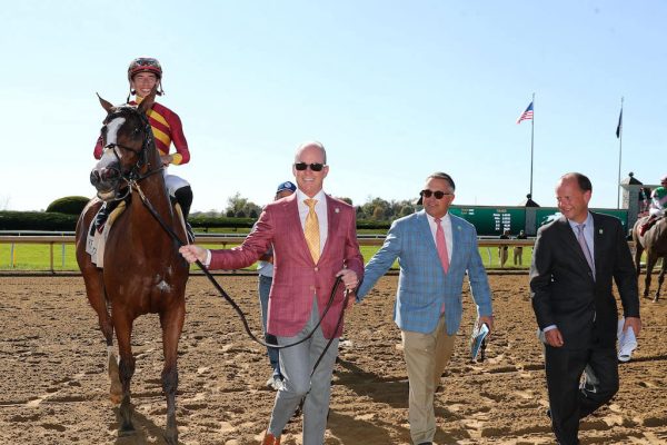 Fancy led into the Winners' Circle by happy owner Scott Heider