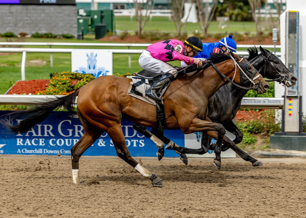 Pretty Sassy shows her grit to run down an opponent and win an Allowance